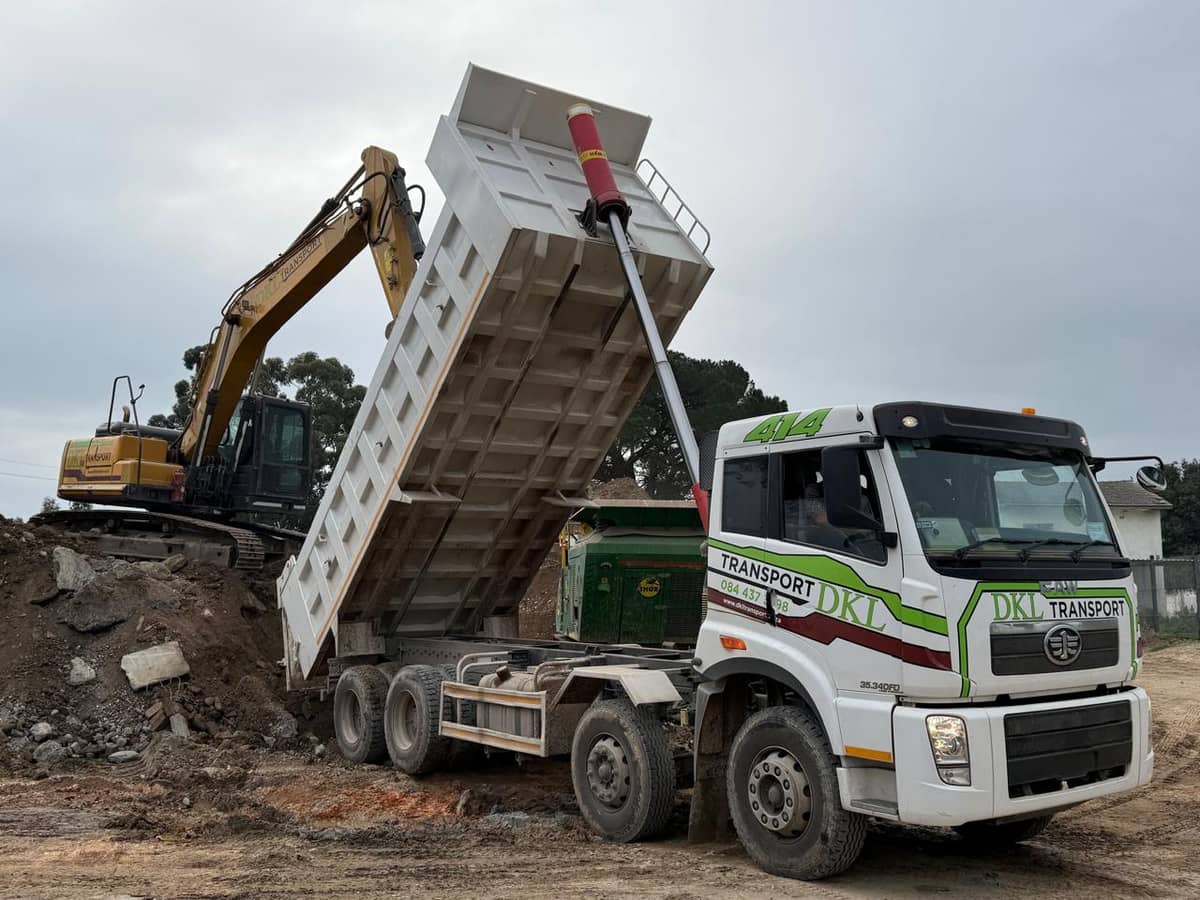 DKL excavator loading a FAW tipper truck